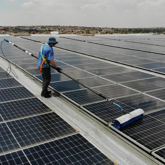 Guy cleaning Solar Panels